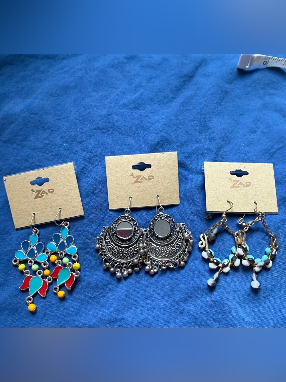 Set of three Zad Silver tone earrings